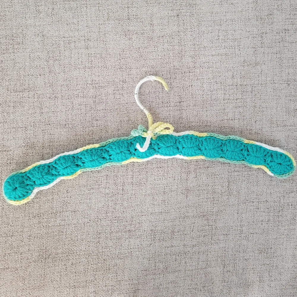 Vintage handmade knit clothing hanger